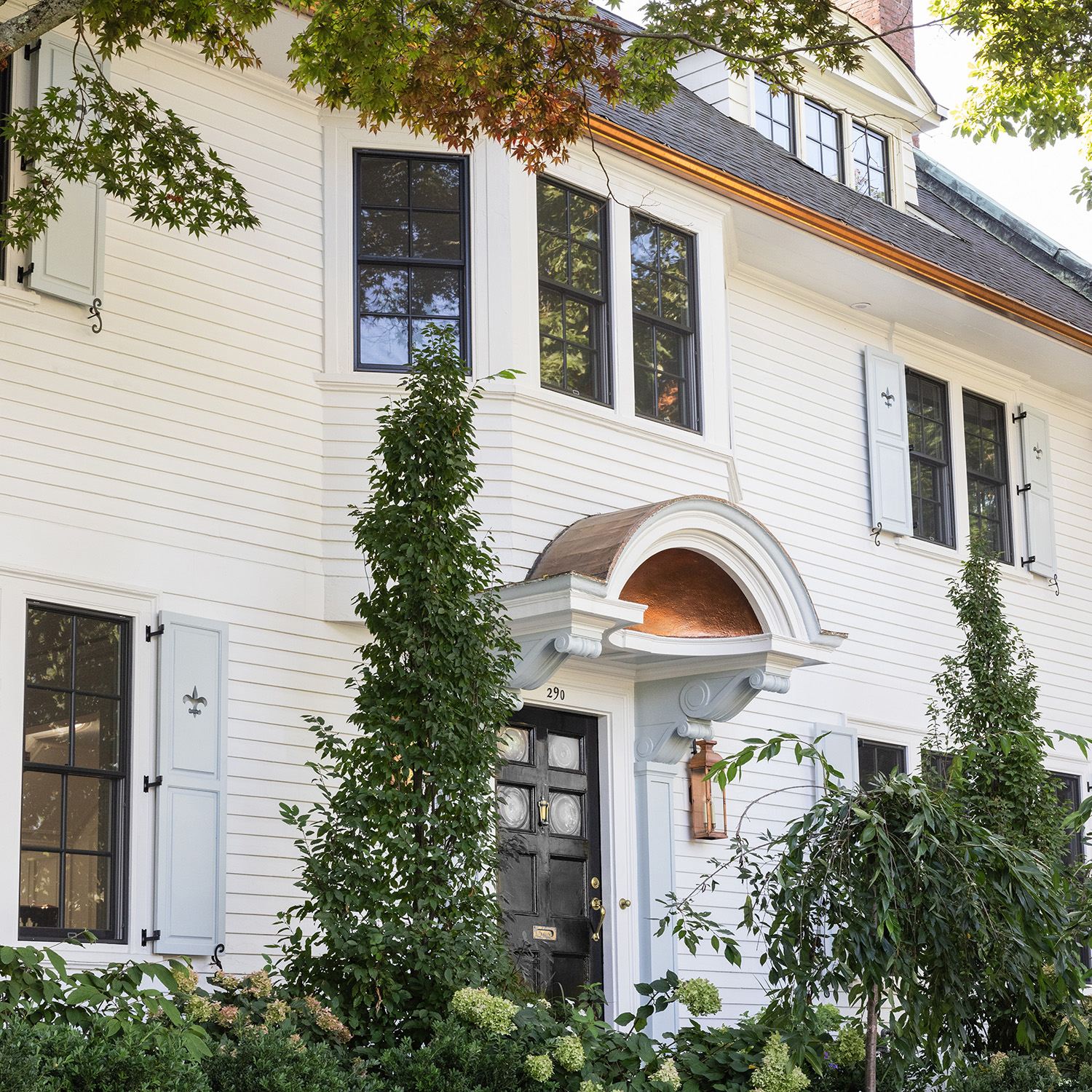 Front exterior of a beautifully restored historic home, blending classic architecture with modern updates.