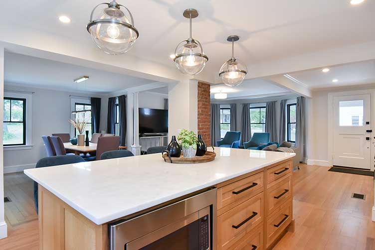 Detail of the functional kitchen island storage and seating area in a renovated RI home.